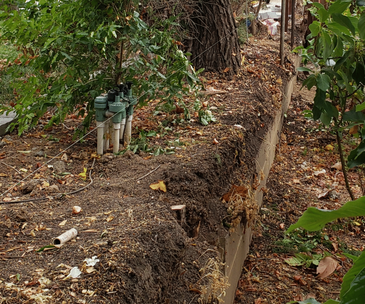 This photo captures the removal of an old leaning fence in Mountain View, highlighting a clean site before rebuild.